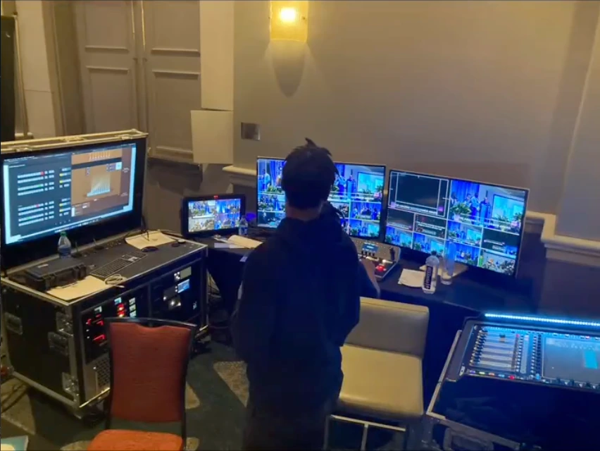 The conference video-control position, with a switching operator, multiview monitors, and production equipment.